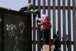 punjabis crossing US mexico border, punjabis crossing US mexico border, video clip shows punjabi women children crossing border fence into u s, Mexico border